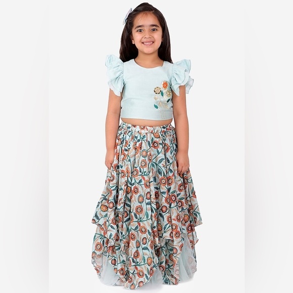 Little muffet Floral Embroidery
Top With Asymmetric Layered Net Frilly
Lehenga - Picture 6 of 11